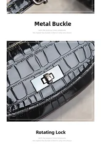 Detail of silver twist lock and hardware on black crocodile texture leather bag