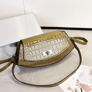 Chic olive green crocodile embossed crossbody bag with silver buckle and leather strap