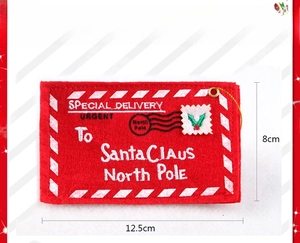 Detail of red felt Christmas envelope ornament with golden string, sized 12.5cm by 8cm