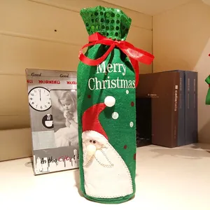 Green velvet Christmas wine bottle cover with Santa Claus embroidery and red ribbon bow