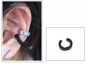 Detail showing layered black and silver stainless steel ear cuffs for non-pierced ears