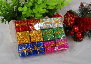 Colorful 12-piece mini Christmas gift box ornaments with shiny metallic finish and ribbons