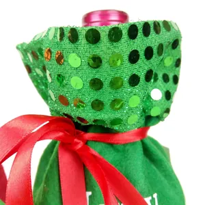 Green sequined Christmas wine bottle cover with red satin ribbon for holiday table decor