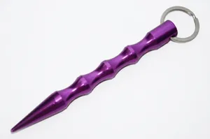 Detail of purple aluminum kubotan self-defense keychain with textured grip and ring
