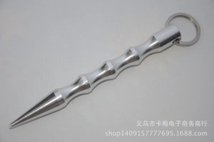 Silver metal self-defense keychain with textured grip and sharp tapered tip detail
