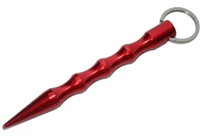 Macro detail of red aluminum self-defense stick keychain with ergonomic finger grooves