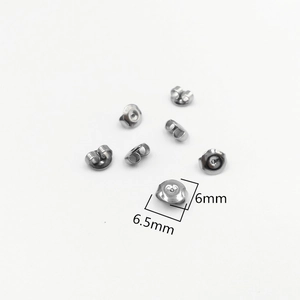 Macro detail of 316L stainless steel earring backs showing 6mm and 6.5mm size specs