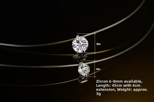 Detail of 6mm and 8mm round zircon pendants on invisible fishing line necklaces
