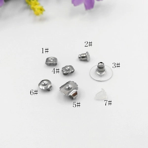 Macro shot of seven styles of 316L stainless steel and silicone earring backs for jewelry