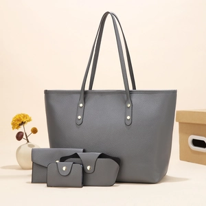 Gray four-piece faux leather bag set including large tote and wallets with lychee texture