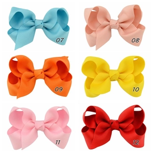 Detailed grid of six colorful ribbed grosgrain ribbon hair bows for girls