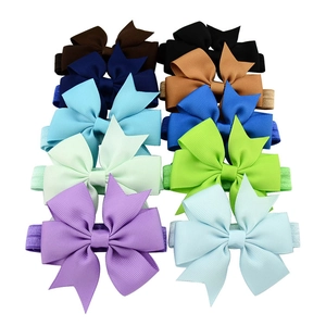 Set of 10 colorful grosgrain ribbon fish tail bows on elastic baby headbands in varied hues