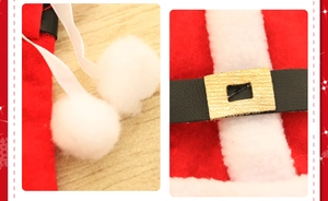 Detailed view of Christmas cutlery holders with plush fur trim and black belt buckles