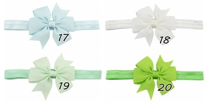Detail grid of ribbon fishtail bow headbands in light blue, white, and green colors