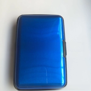 Detail view of the durable blue aluminum card case with secure latch and waterproof seal