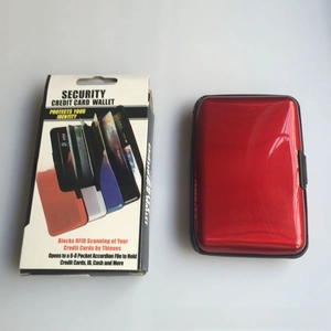 Detail of red RFID blocking aluminum card holder with its protective retail packaging box