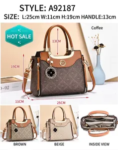 Detailed interior compartments and logo pendant of this stylish crossbody handbag