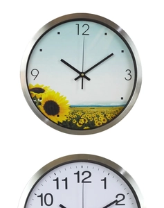 Close-up of 12 inch brushed stainless steel wall clock featuring a modern silver metal frame
