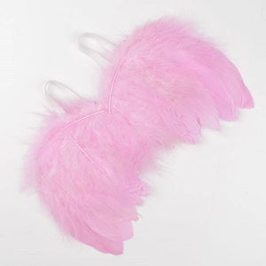 Detailed view of pink feather angel wings with white elastic straps for baby photography