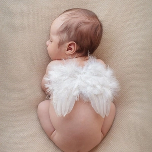 Detailed view of soft white angel wings feathers for newborn photography props