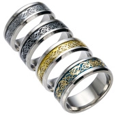 Detailed close-up of stainless steel rings with celtic dragon motifs in multiple finishes