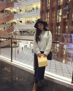 British style wool felt fedora with a wide brim shown in a fashion lifestyle setting