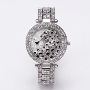 Luxury women's silver steel watch with sparkling rhinestones and a 3D leopard dial