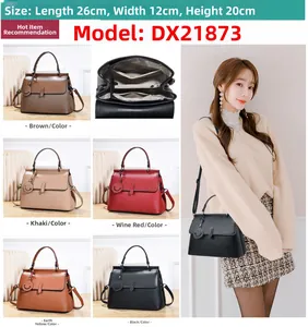 Detail of the multi-compartment interior and five color options for this leather handbag