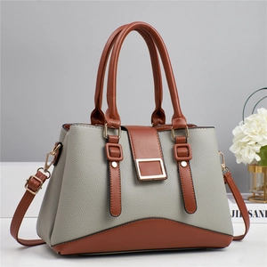 Two-tone grey and brown leather handbag with top handles and adjustable shoulder strap