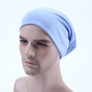 Side view of light blue knitted beanie hat with soft cotton texture on a mannequin