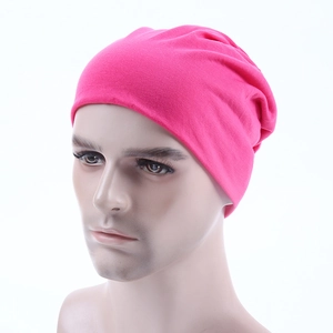 Detail of rose pink knit beanie showing high-elasticity fabric texture on a head model