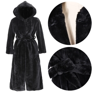 Detail of black faux fur coat showing buckle closure, plush texture, and belted waist