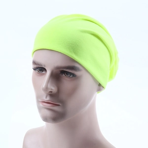 Detailed close-up of fluorescent yellow slouchy beanie with fine knitted texture