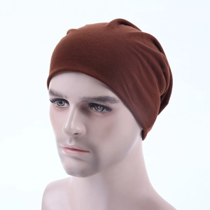 Detailed close-up of dark brown knit beanie texture on a mannequin head model