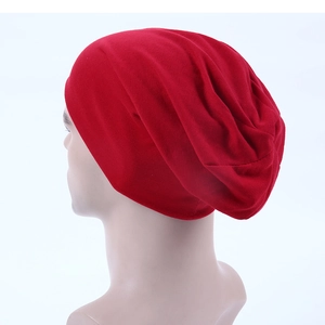 Detailed back view of a bright red slouchy beanie showing soft knit texture and drape