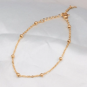Titanium steel thin bead bracelet in gold finish with lobster clasp and extender