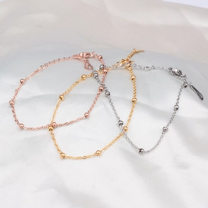 Minimalist titanium steel beaded chain bracelets in rose gold, gold, and silver finishes