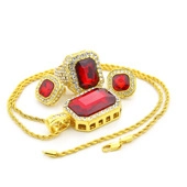 Detailed view of hip hop gold jewelry set featuring red rectangular gems and rhinestones