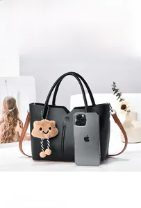 Detail of black pebbled leather bucket bag showing large capacity for daily essentials