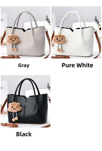 Detailed view of lychee texture tote bags in grey, white, and black with cloud charms