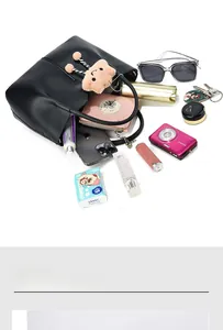 Interior view of black leather bucket bag showing large capacity for essentials