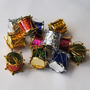 Close-up of colorful acrylic Christmas drum ornaments with metallic texture and hangers