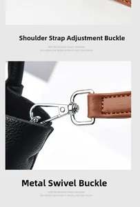 Detailed macro view of adjustable silver metal buckles and leather strap of the bucket bag