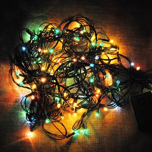 Detail of colorful LED Christmas string lights with black cable and control box