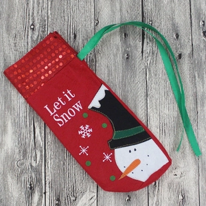 Christmas stocking decoration with red sequins, snowman applique, and Let it Snow embroidery