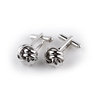 Detailed view of silver polished twist knot cufflinks with secure T-shaped toggle closure