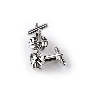 Detailed view of silver twist knot cufflinks for men's shirts featuring a woven metal design