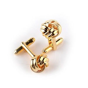 Detailed view of golden twisted knot cufflinks with rotatable T-bar toggle closures