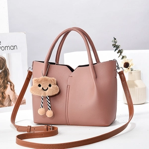 Chic pink lychee texture tote bag with plush cloud charm and adjustable crossbody strap