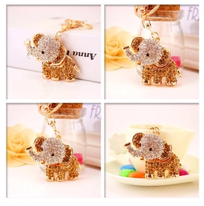 Detailed views of sparkling gold elephant keychain with crystals in four lifestyle angles
